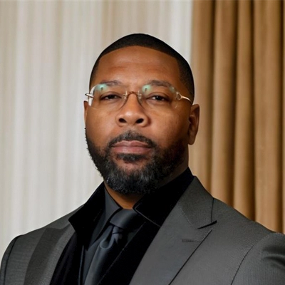 A headshot of Robert Dobynes Jr., the owner of Eye Fashion Factory.