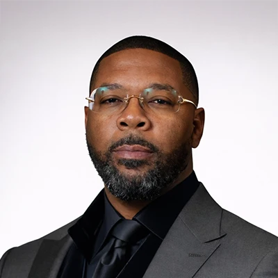A headshot of Robert Dobynes Jr., the owner of Eye Fashion Factory.